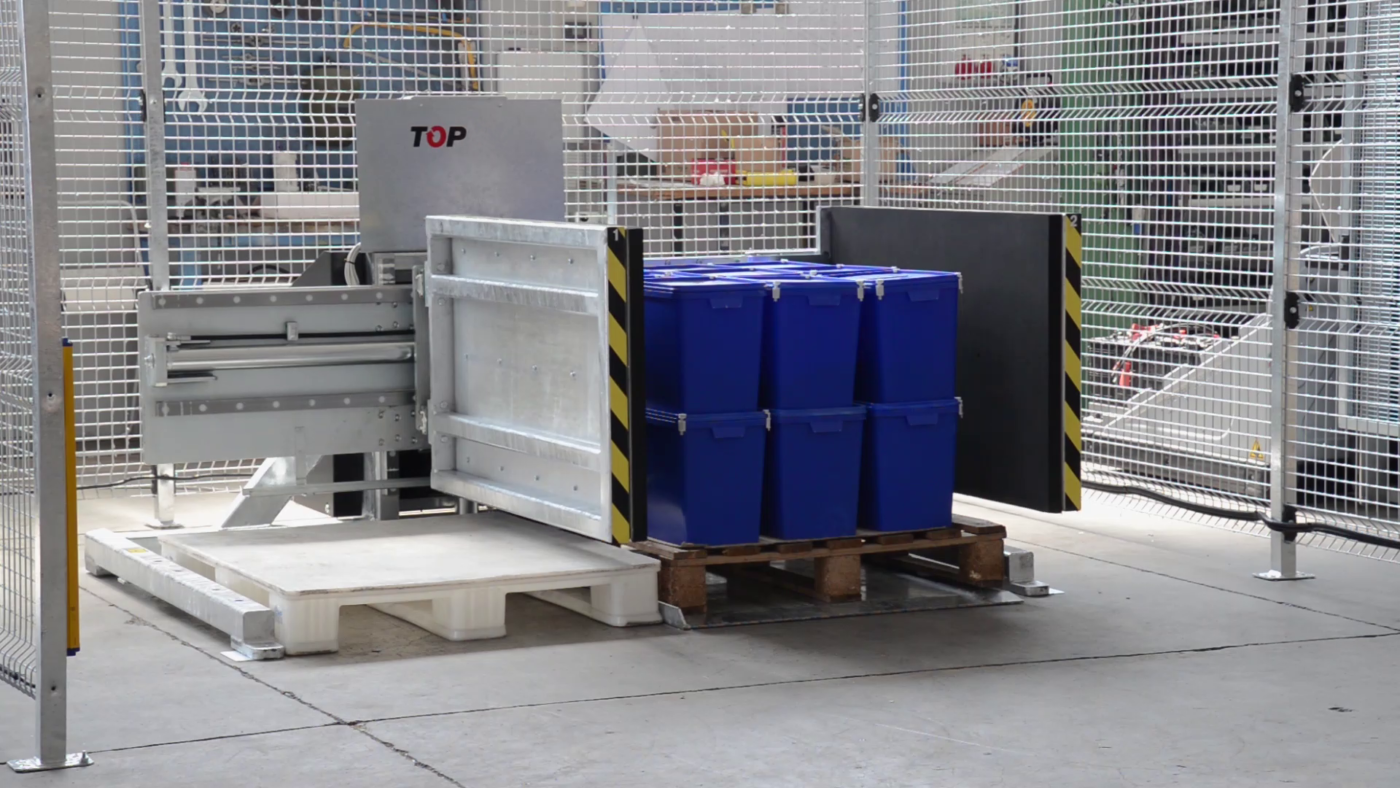 Stationary pallet changer side mover with plastic buckets