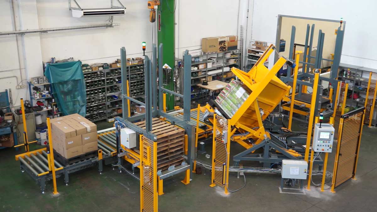 Pallet upender in use to lift and turn pallets