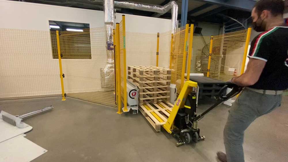 Electric pallet truck in warehouse