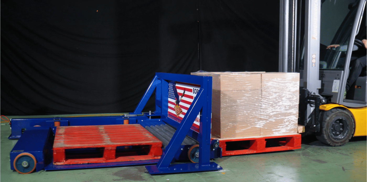 Eagle Mover stationary pallet changer performing pallet exchange in industrial warehouse